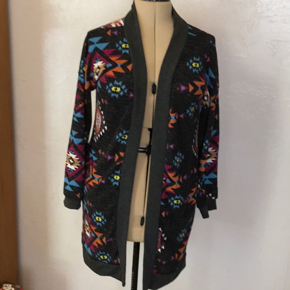 Light weight Southwestern hip length pocketed cardigan in good condition.